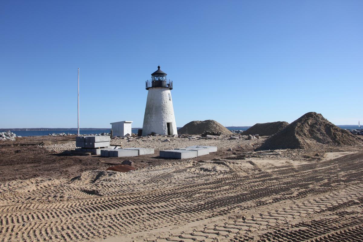 Light House with Dirt Piles Surrounding It