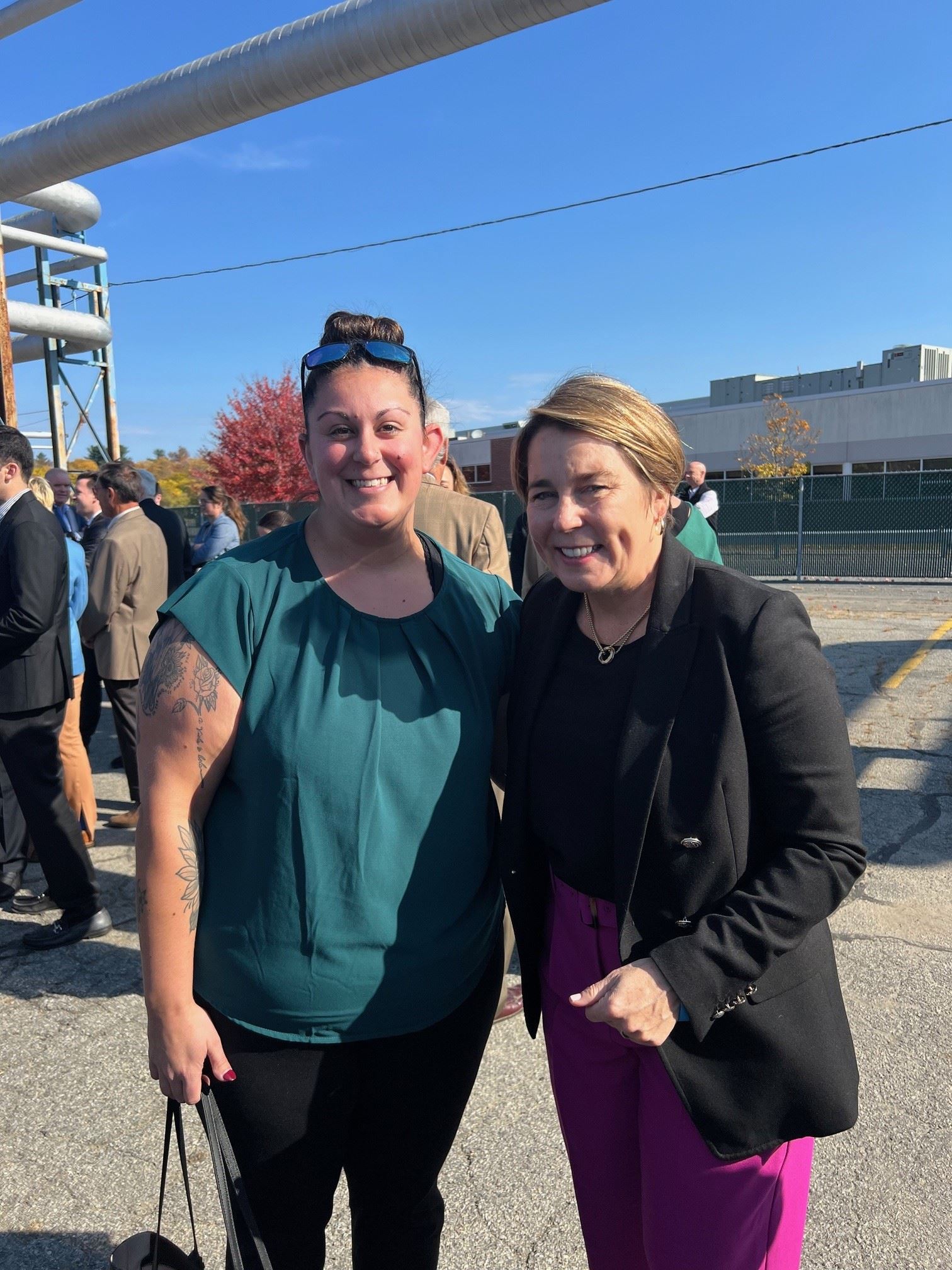 Community One Stop Award Celebration - Emily Miller and Gov Healey, green shirt, sunglasses on head